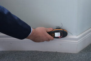 Property Claims Loss Assessor carries out checks to a water damaged house.