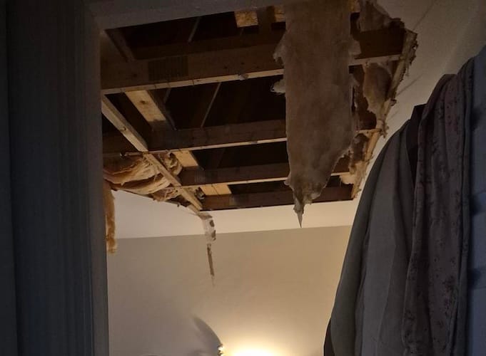 a burst pipe hidden in the ceiling of their Hilltown detached home